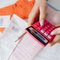 Working out contractor website cost on a calculator beside a stack of receipts